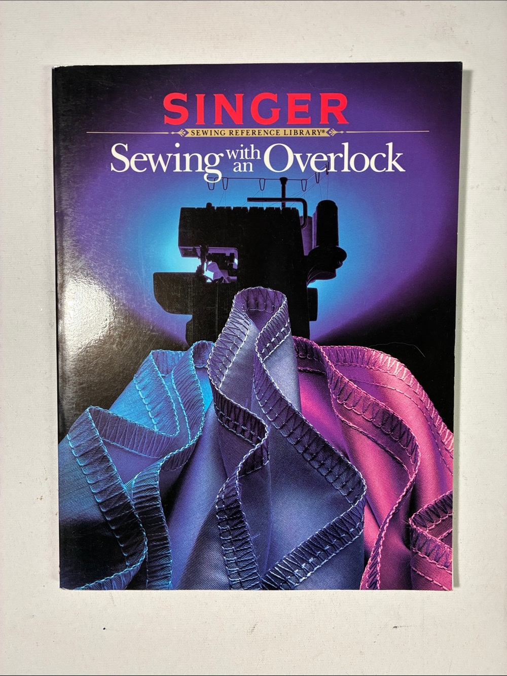 Sewing with an Overlock Reference Guide - Purple/Blue/Pink